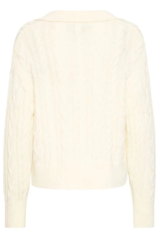 a cream cable knit pullover on a white background