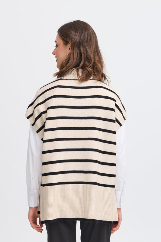Woman wearing a striped sweater vest on a white background