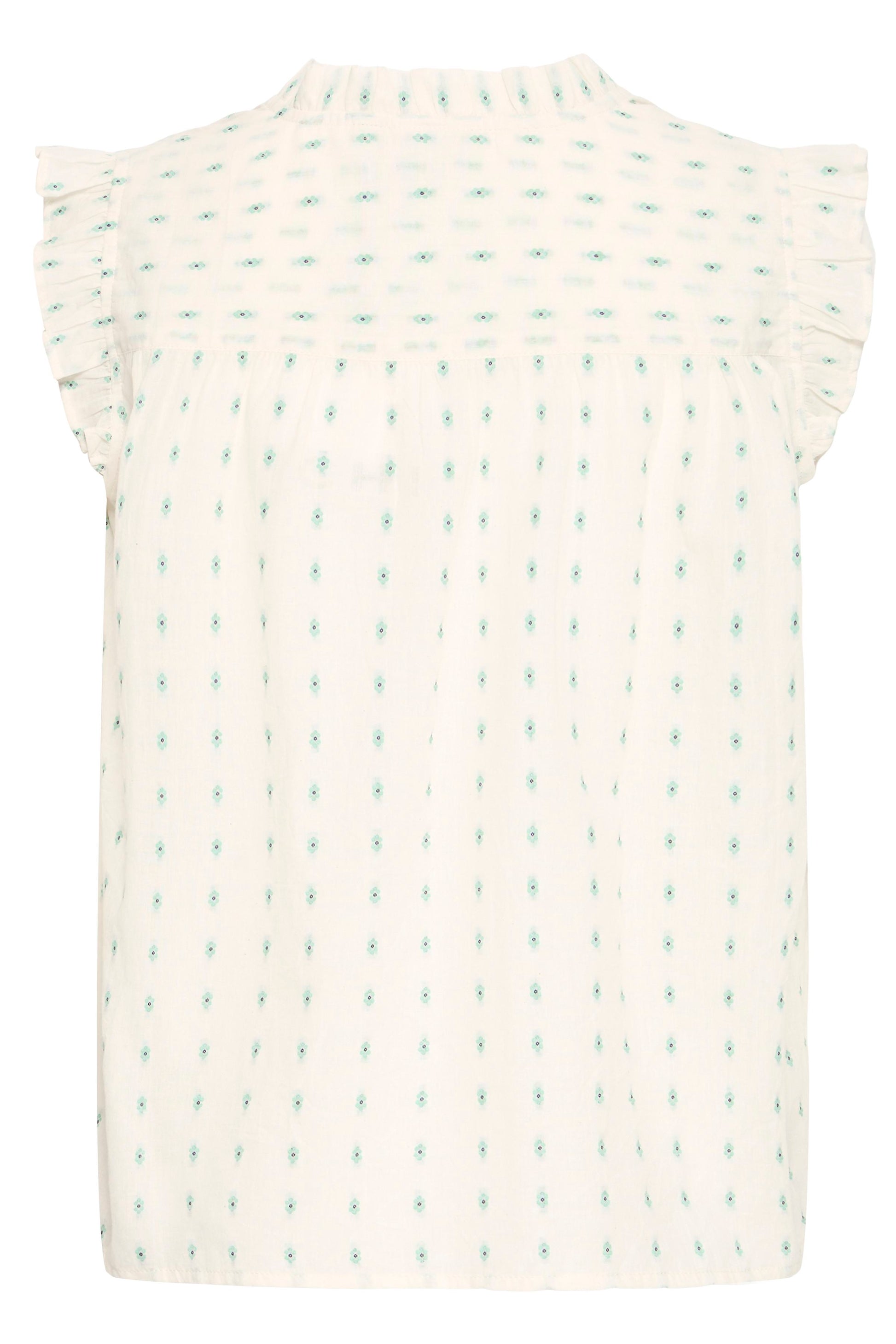 White sleeveless top with small green pattern on a white background