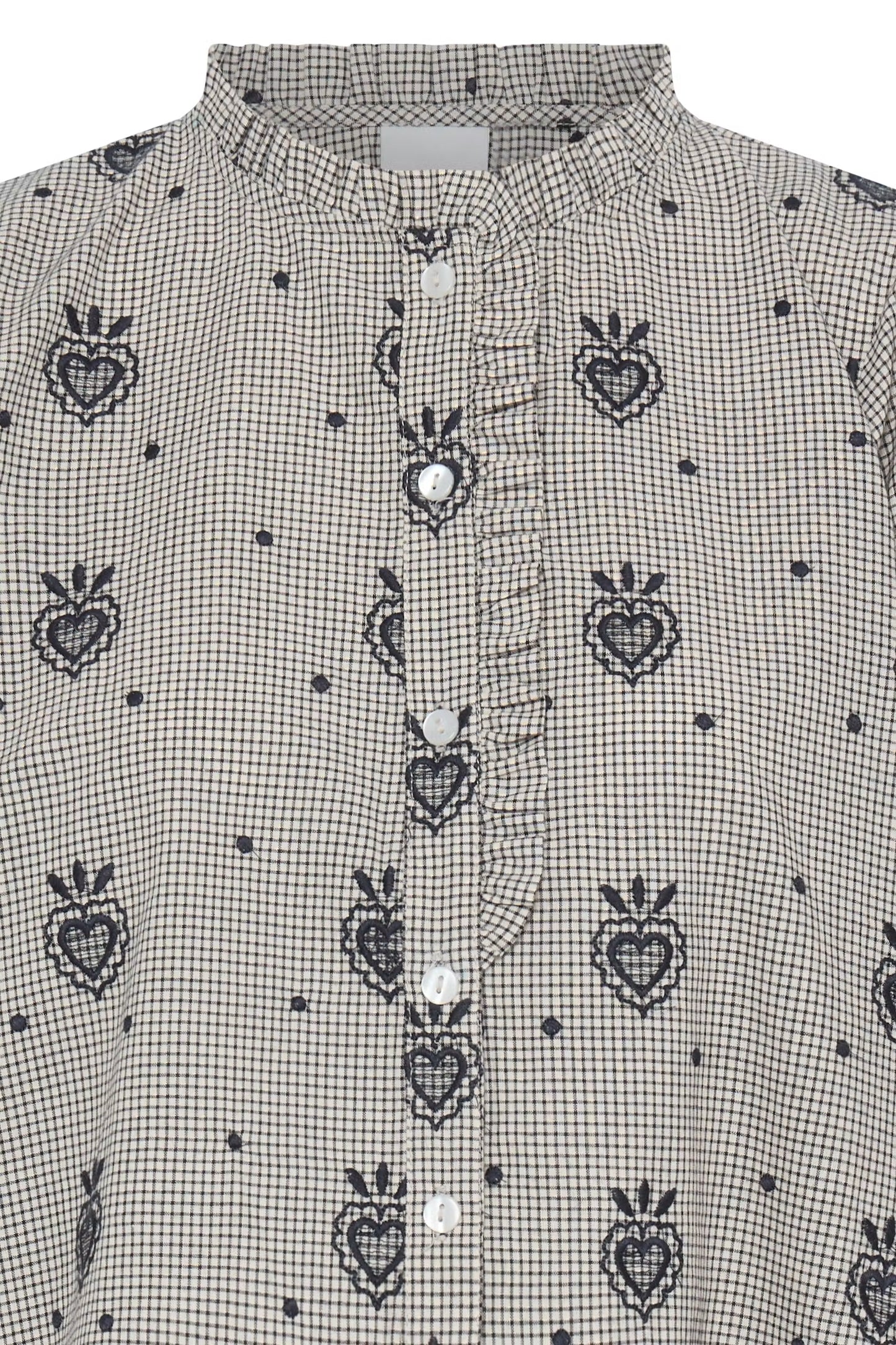 a gray long-sleeve blouse with a repeating dark blue embroidered heart and crown motif