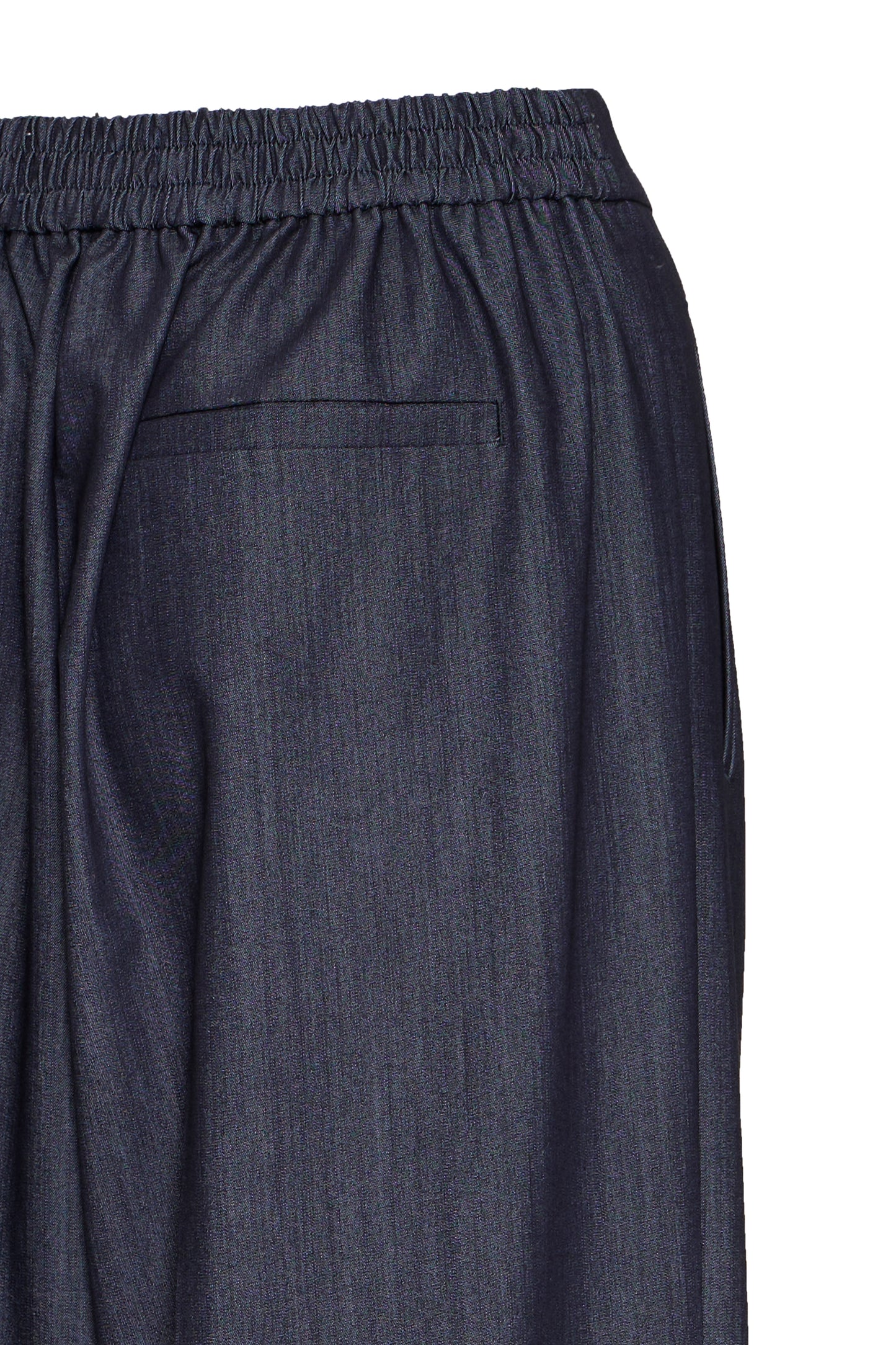 Close-up of dark gray pants on a white background