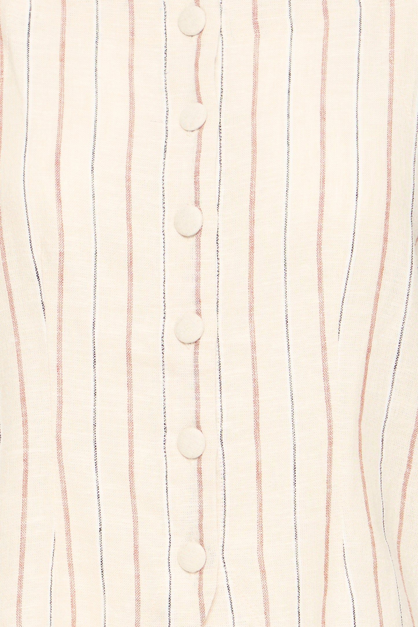 Close-up of a fabric with vertical stripes and buttons on a light background