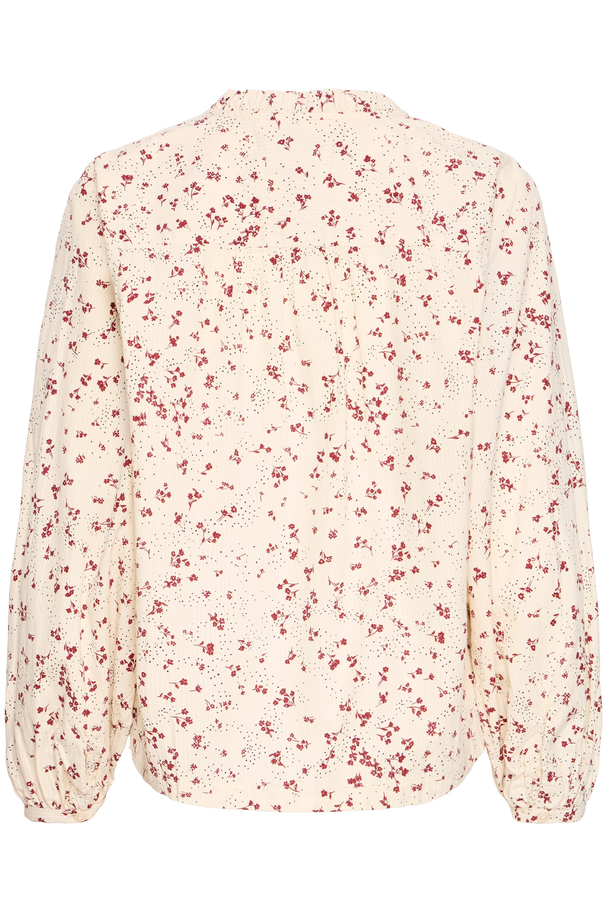 Floral blouse with red pattern on a white background