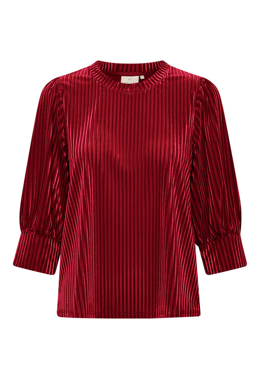 Red pleated blouse on a white background