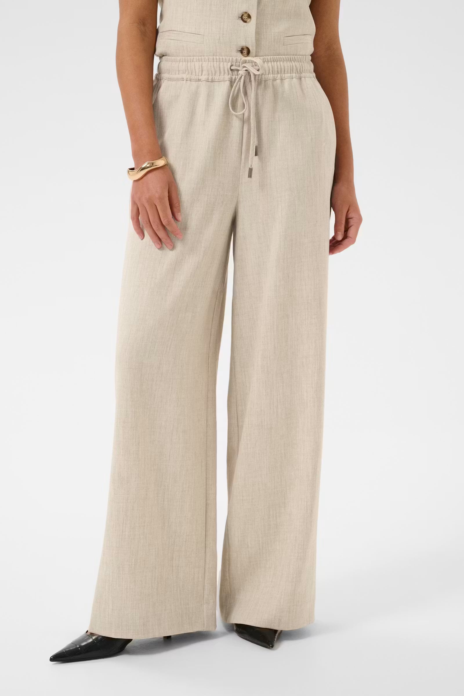 Beige trousers on white background