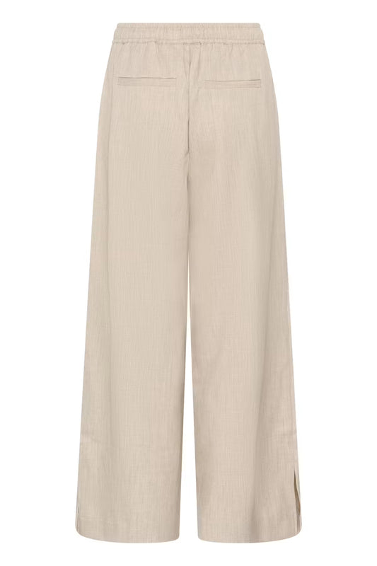 Beige trousers on white background