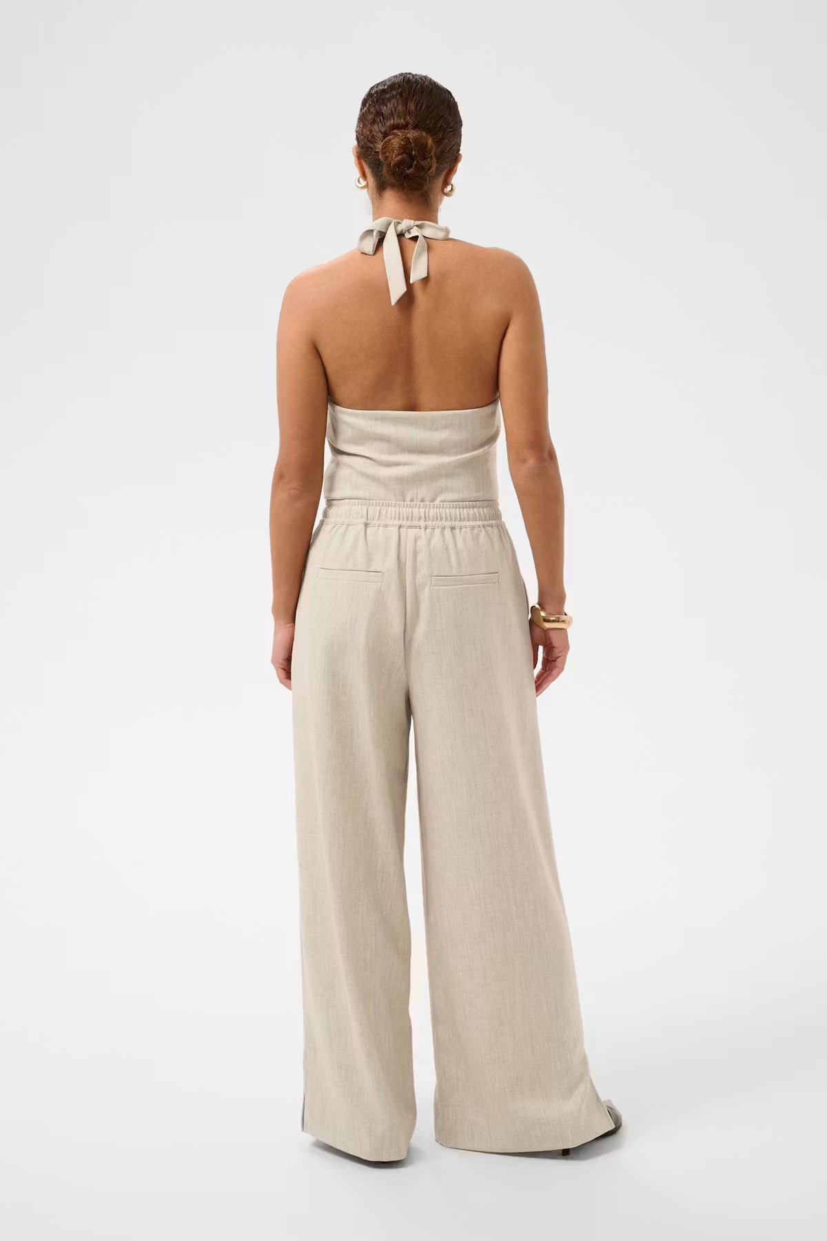 Beige trousers on white background