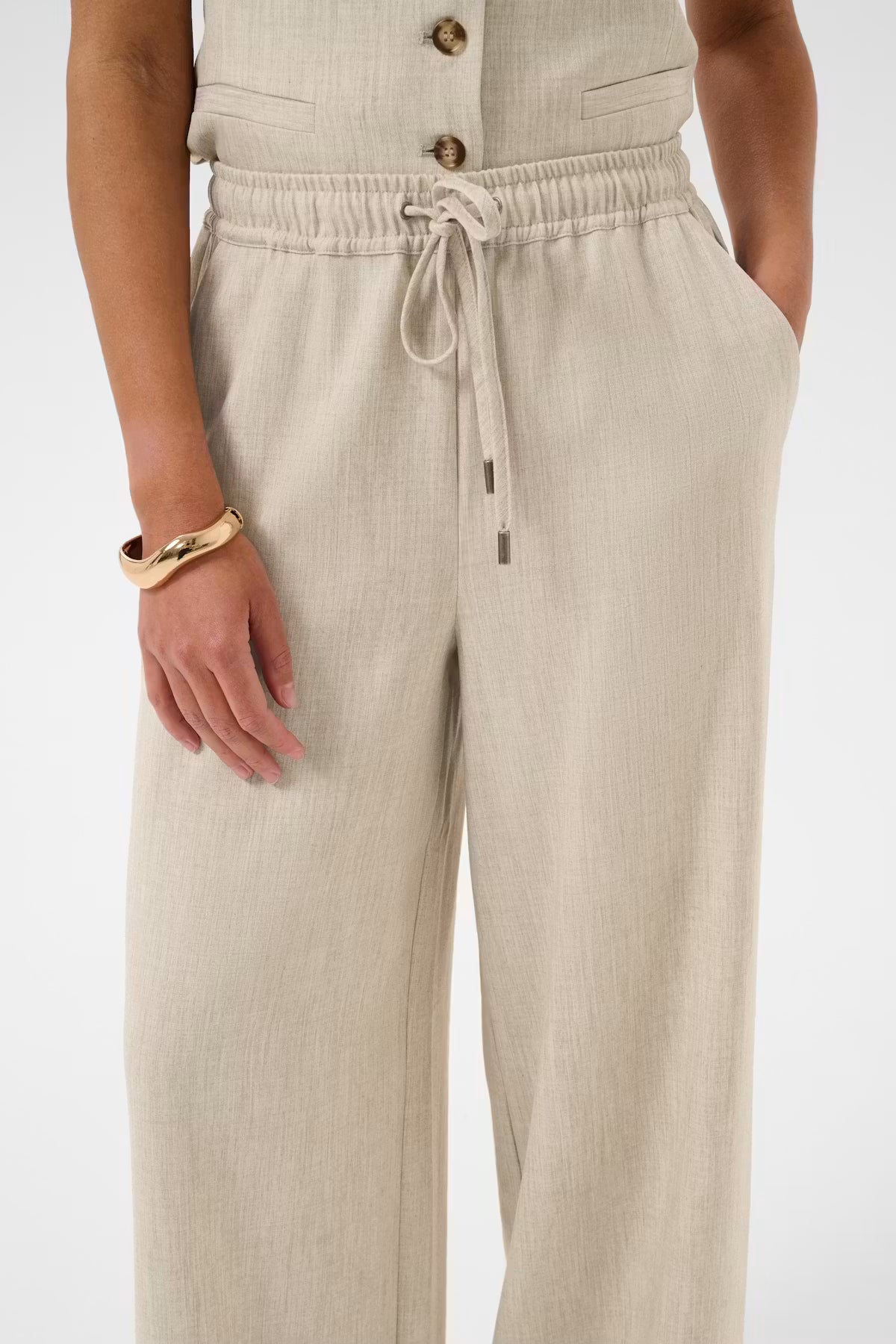 Beige trousers on white background