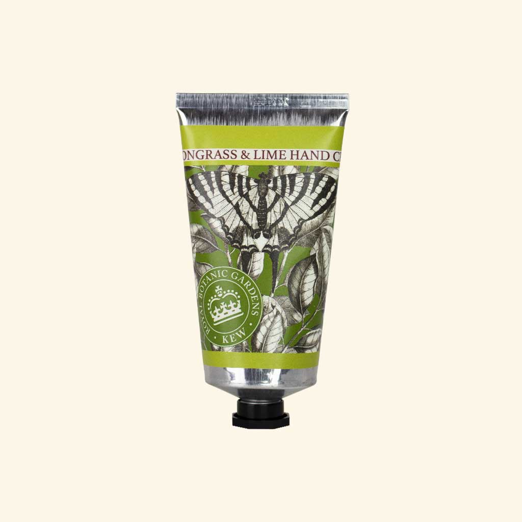 Hand cream tube with butterfly design and green label on a beige background