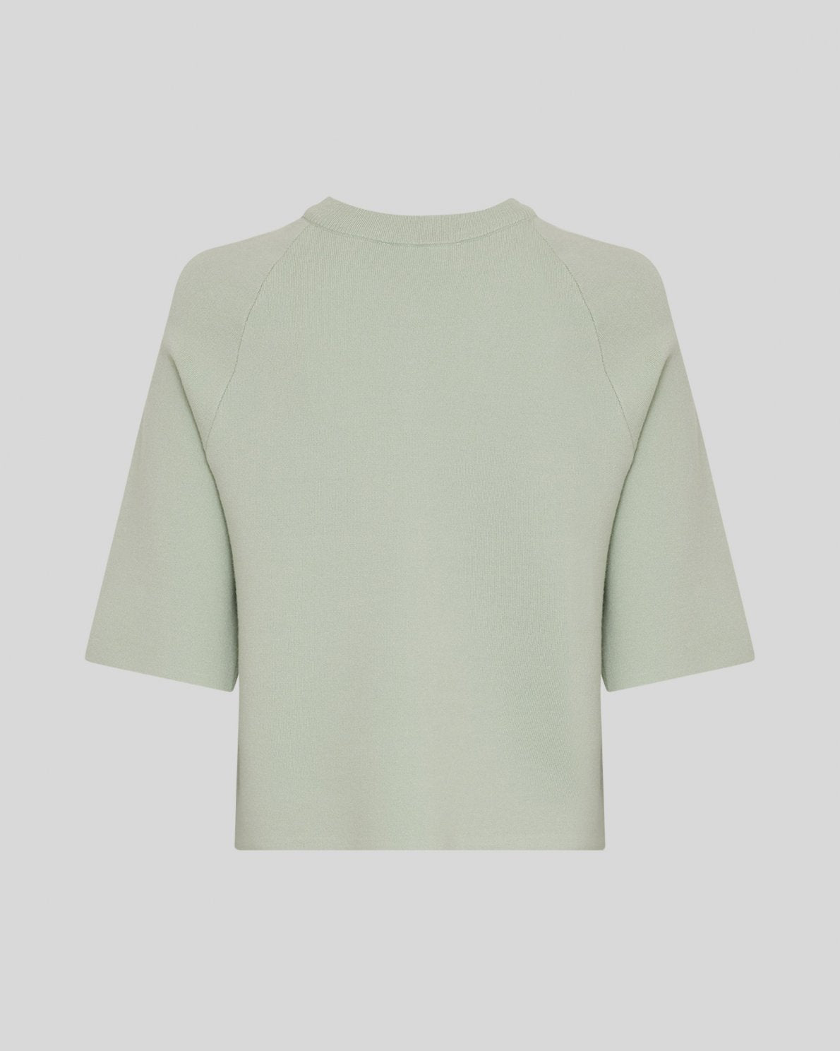 light green cardigan on light grey background