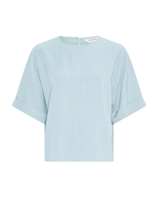 light blue t-shirt on a light grey background