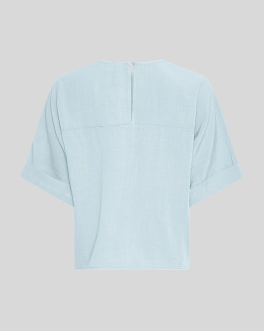 light blue t-shirt on a light grey background