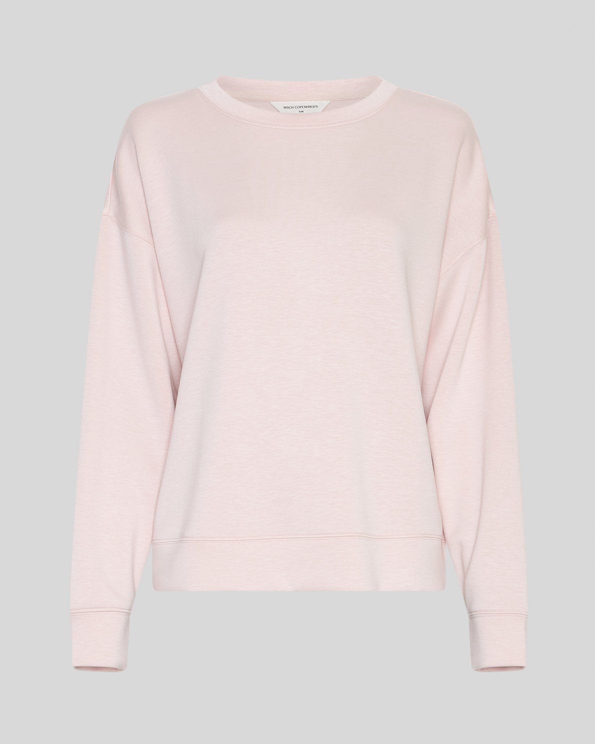 Light pink sweatshirt on a neutral background