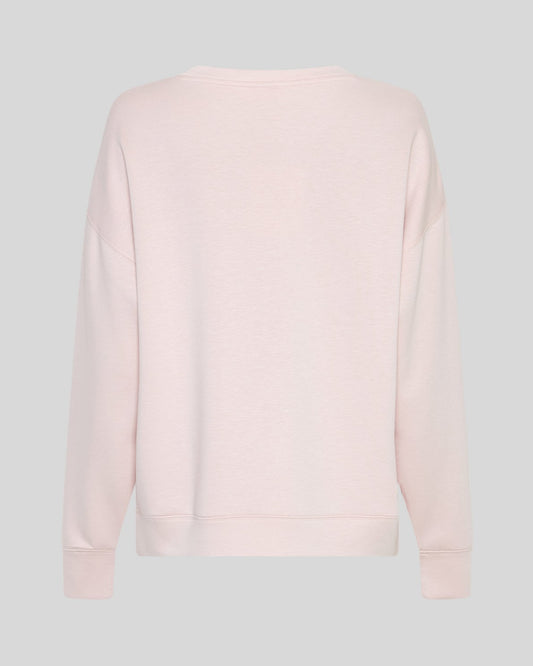 A light pink crewneck sweatshirt shown from the back, displayed on a neutral light gray background.