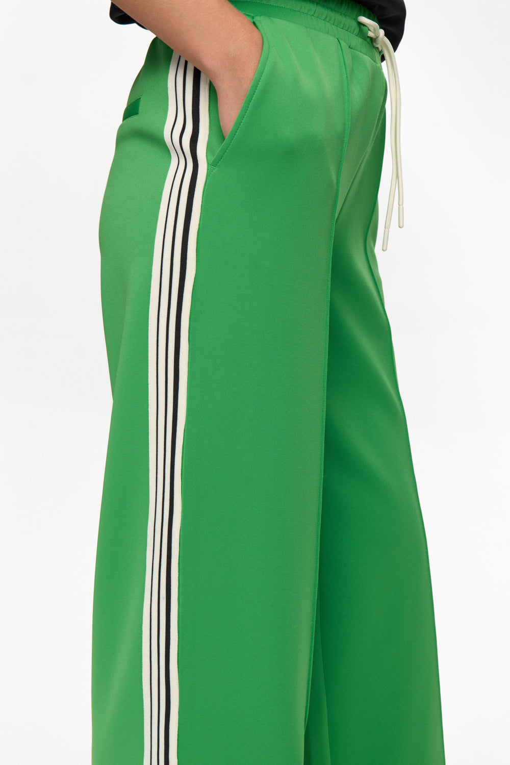 Green pants with white stripes on a white background