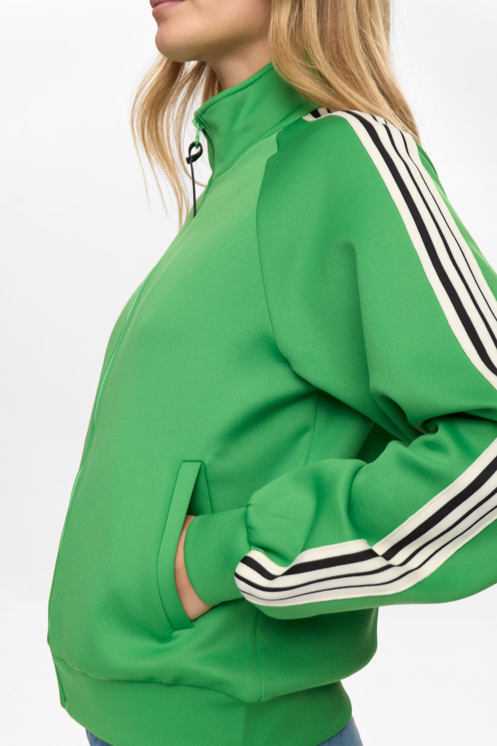 Green tracksuit with black and white stripes on a white background