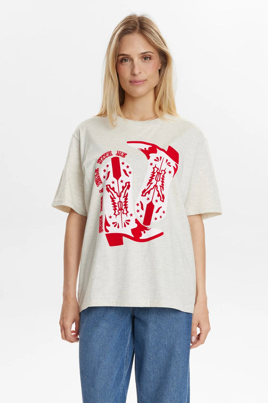 Woman wearing a white t-shirt with a red graphic design on a plain background