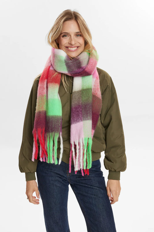 Woman wearing a colorful scarf on a white background