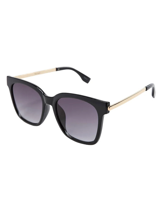Black sunglasses with gold frames on a white background