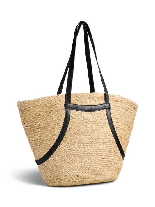 Beige straw tote bag with black straps on a white background