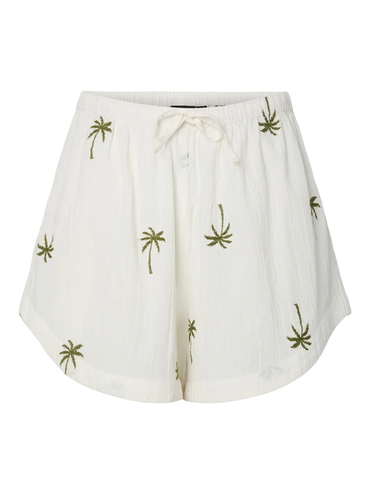 White shorts with green leaf patterns on a white background