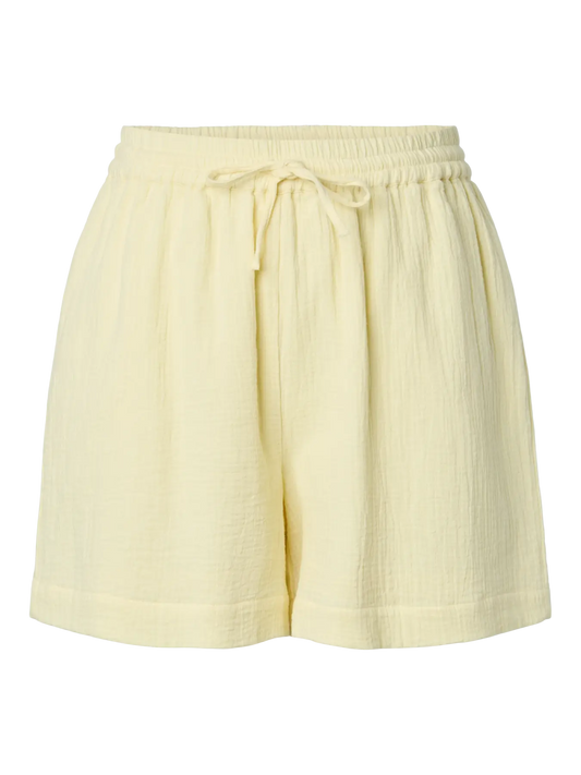 Light yellow shorts with a tie waist on a white background