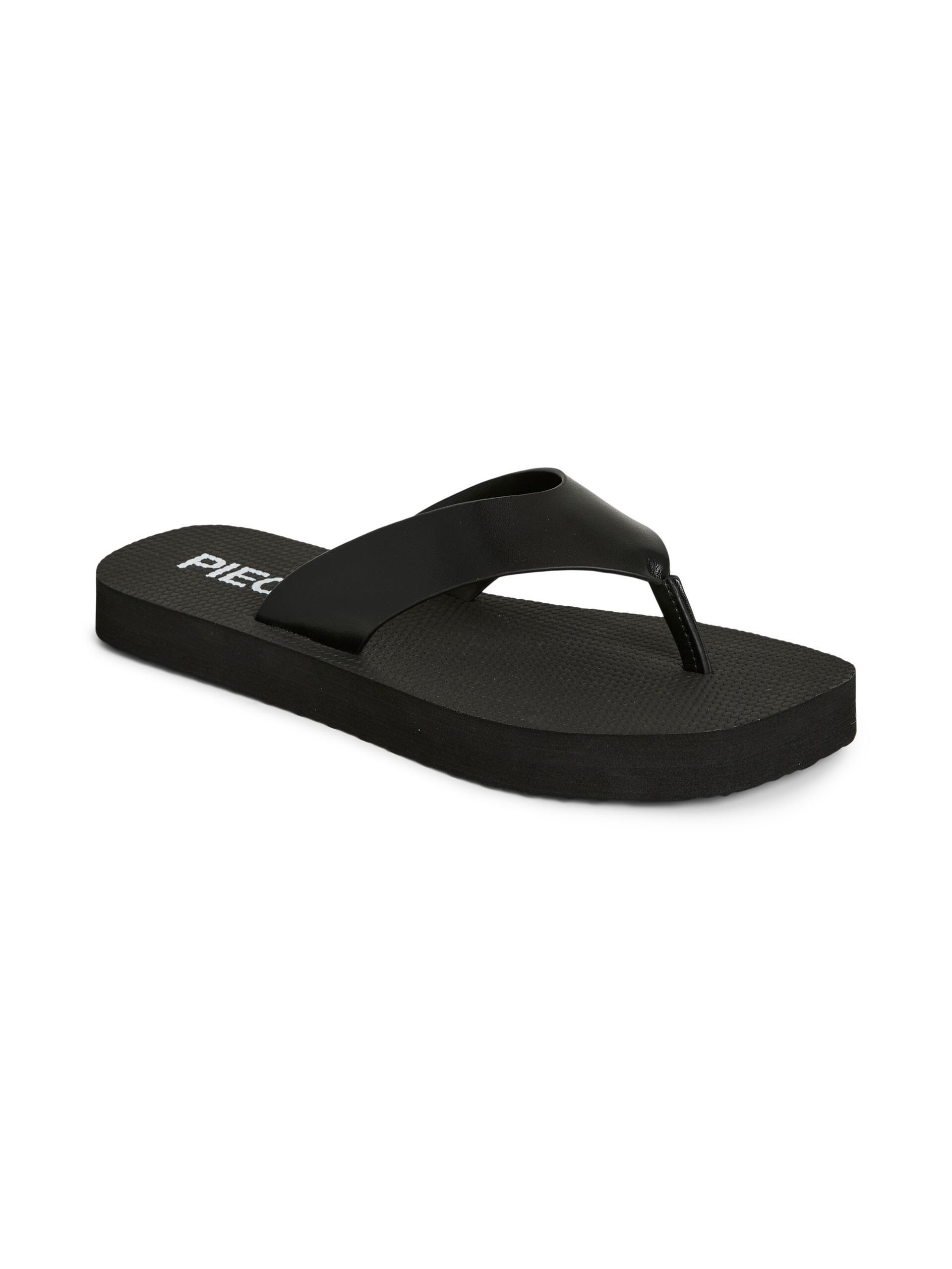 black flip flops on a white background