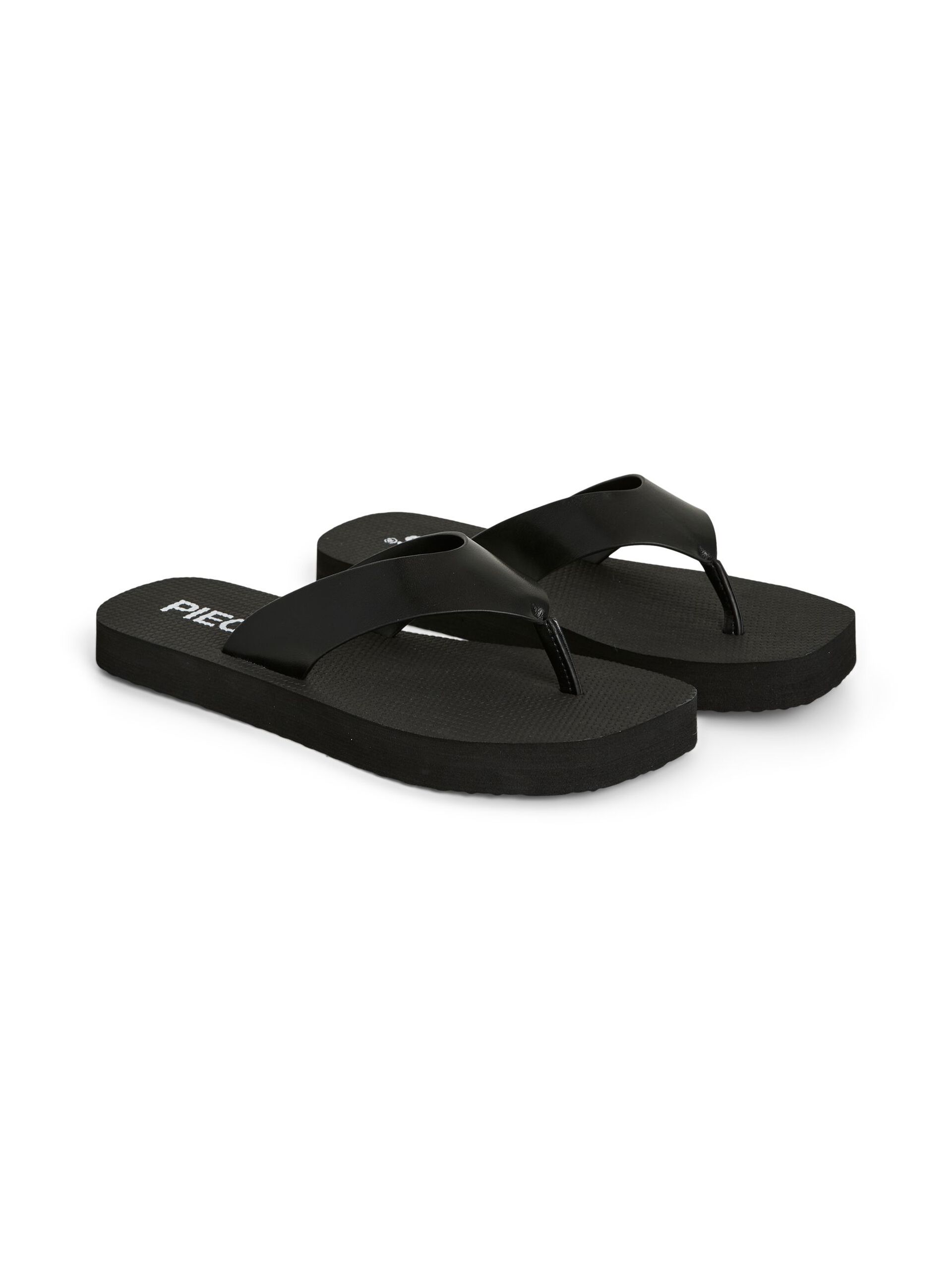 black flip flops on a white background