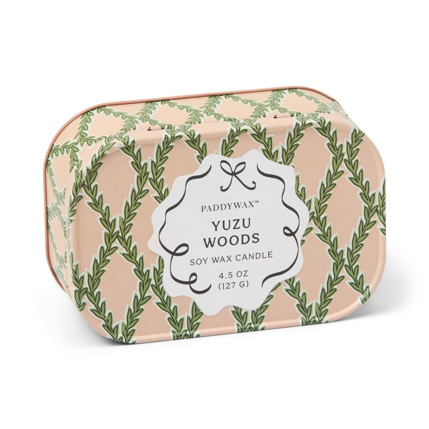 Paddywax Yuzu Woods candle in a decorative tin with green leaf pattern on a white background