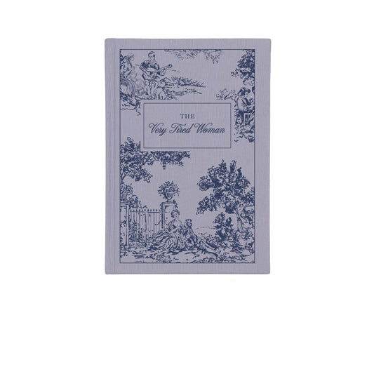 Book titled 'The Very Tired Woman' with decorative cover design on a white background