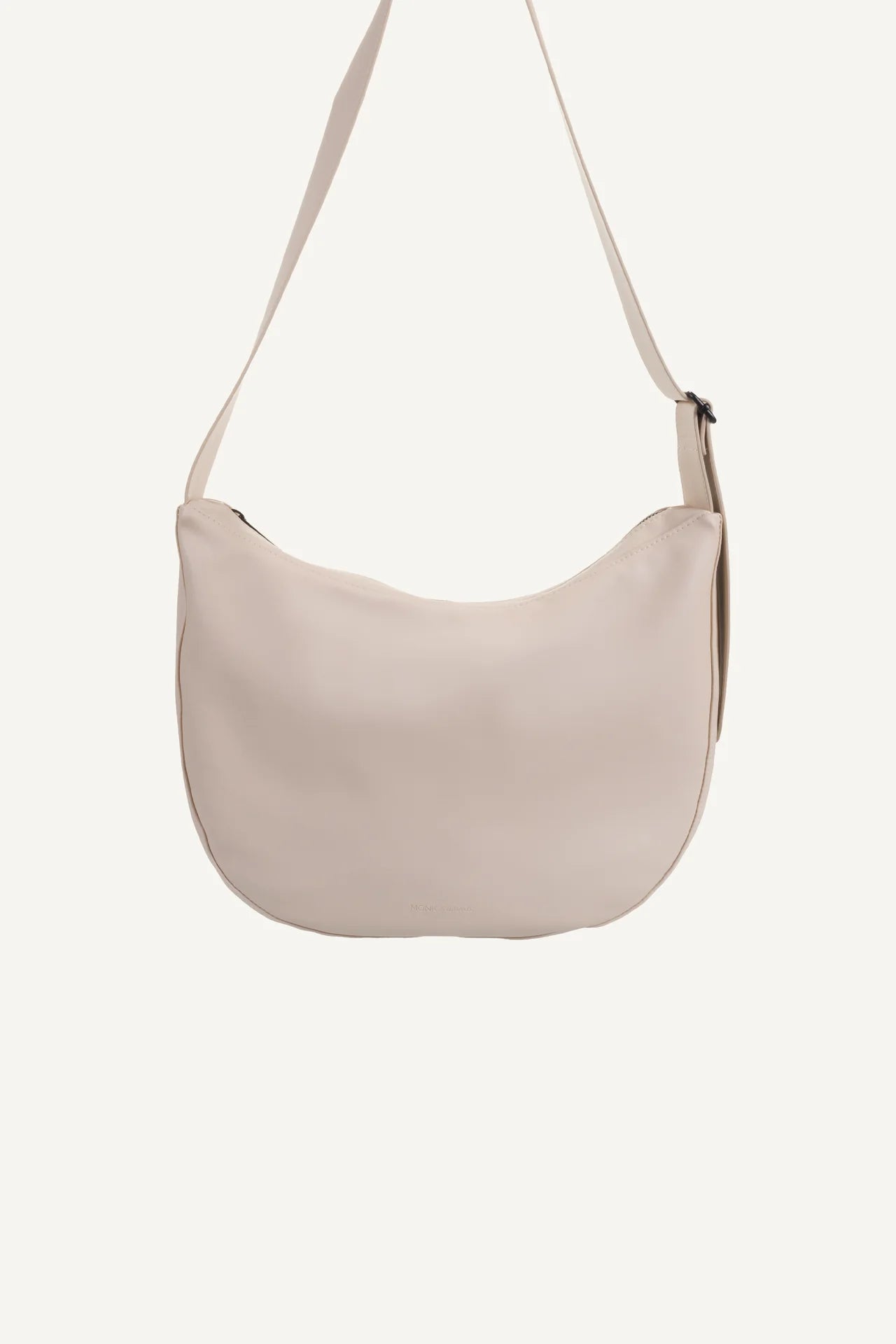Cross body handbag in stone colour on white background