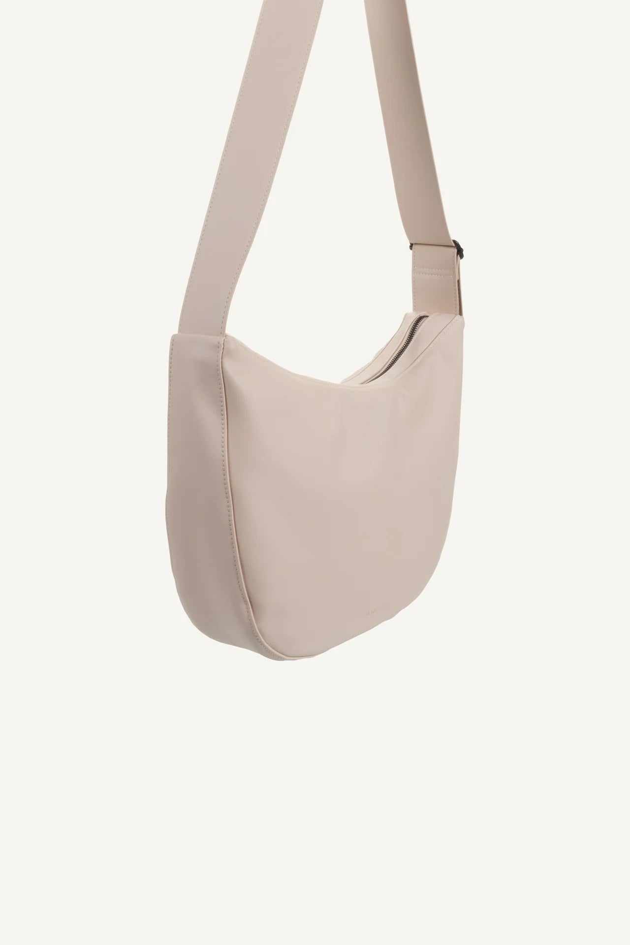 Cross body handbag in stone colour on white background