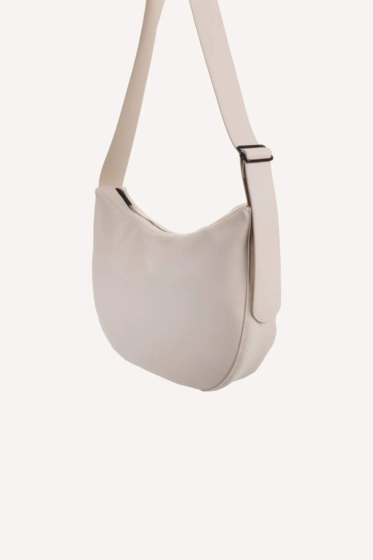 Cross body handbag in stone colour on white background