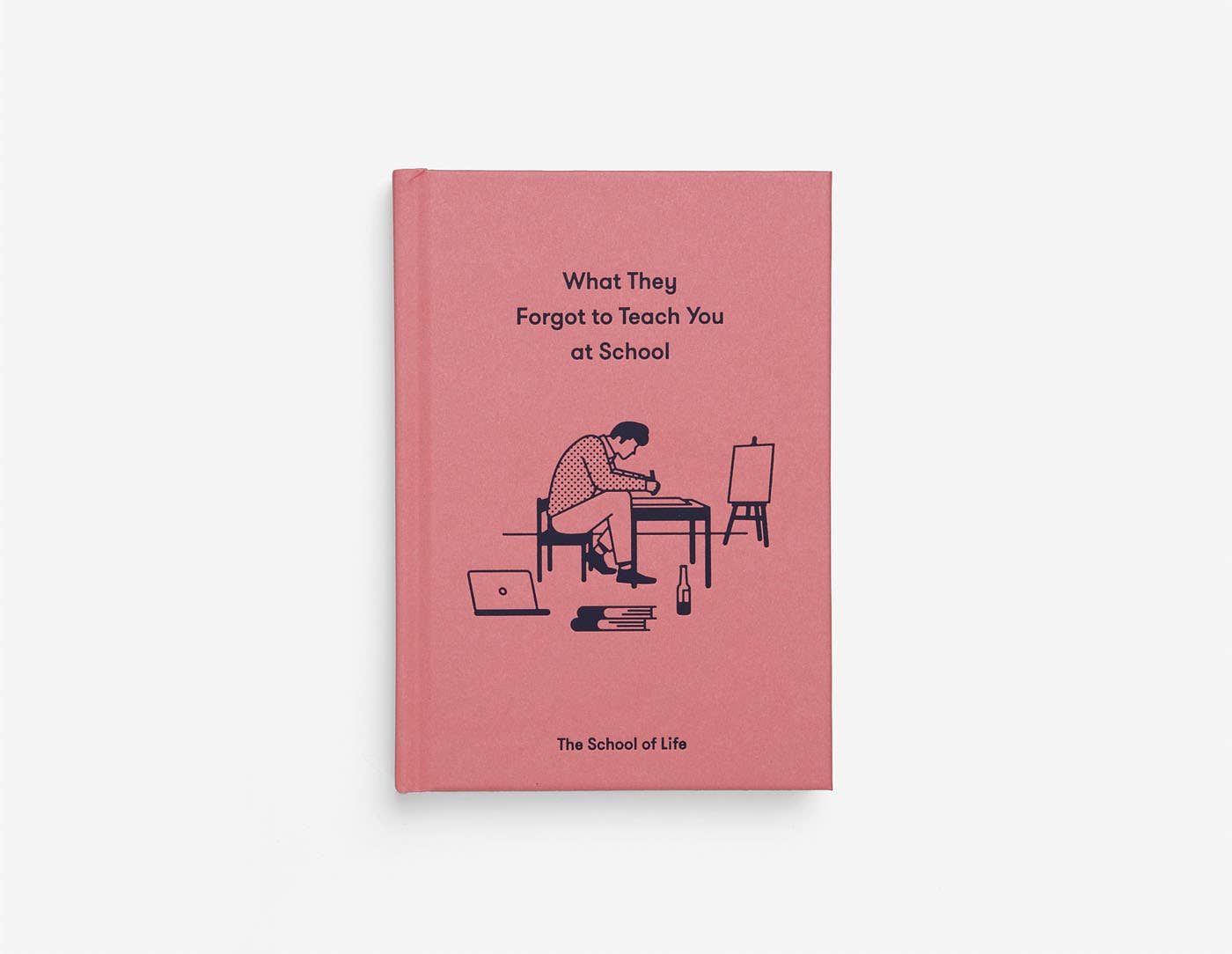 Book titled 'What They Forgot to Teach You at School' by The School of Life on a pink cover with illustrations.