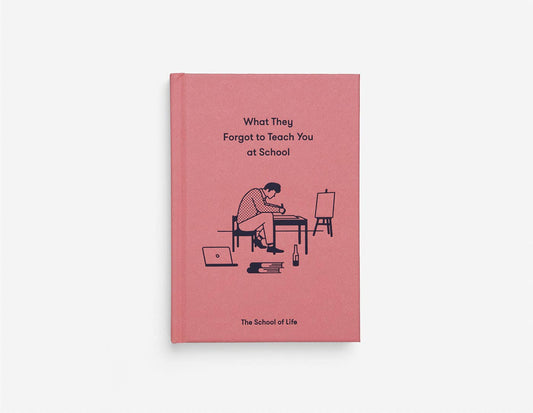Book titled 'What They Forgot to Teach You at School' by The School of Life on a pink cover with illustrations.