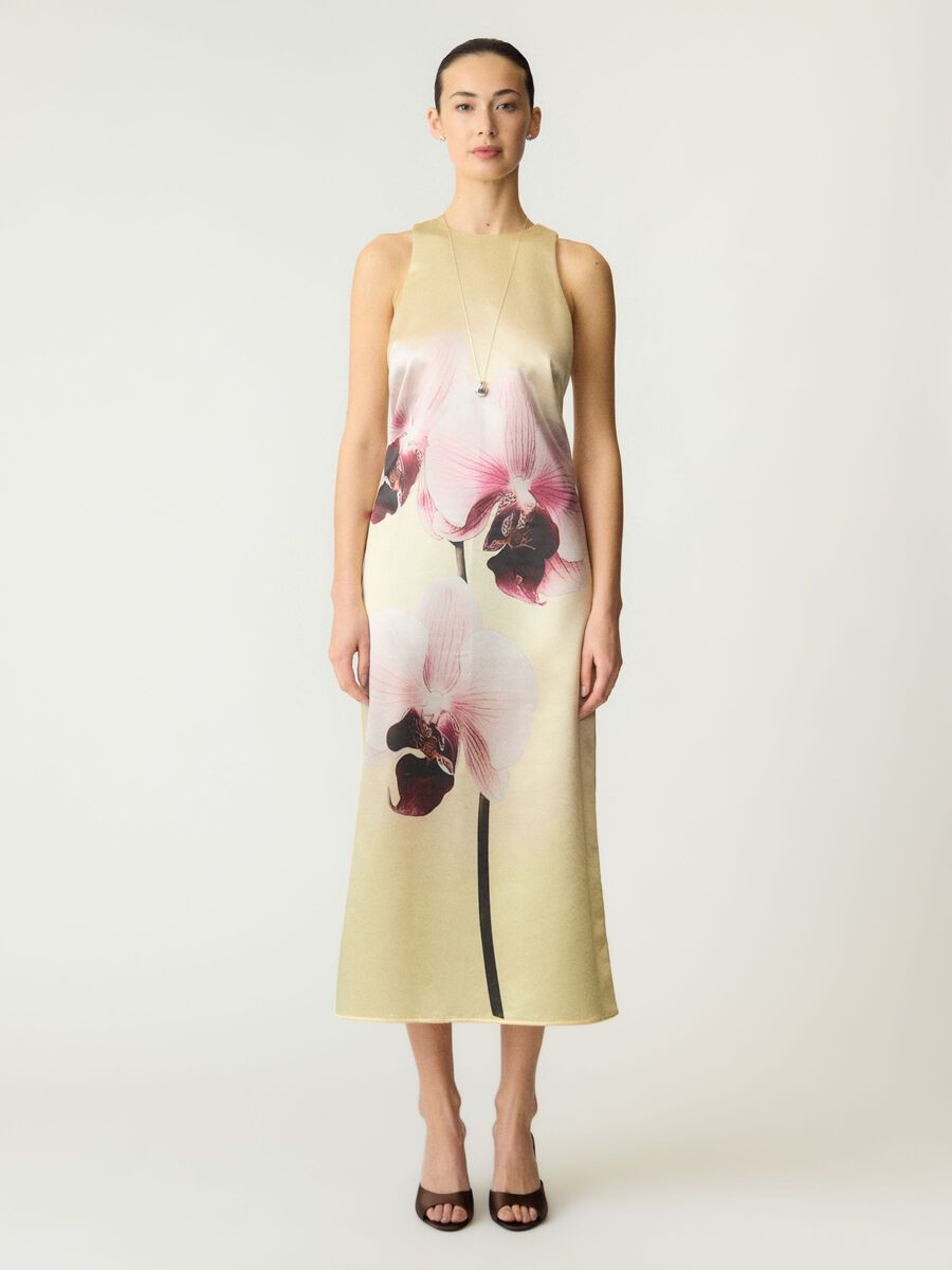 Woman wearing a floral dress on a white background