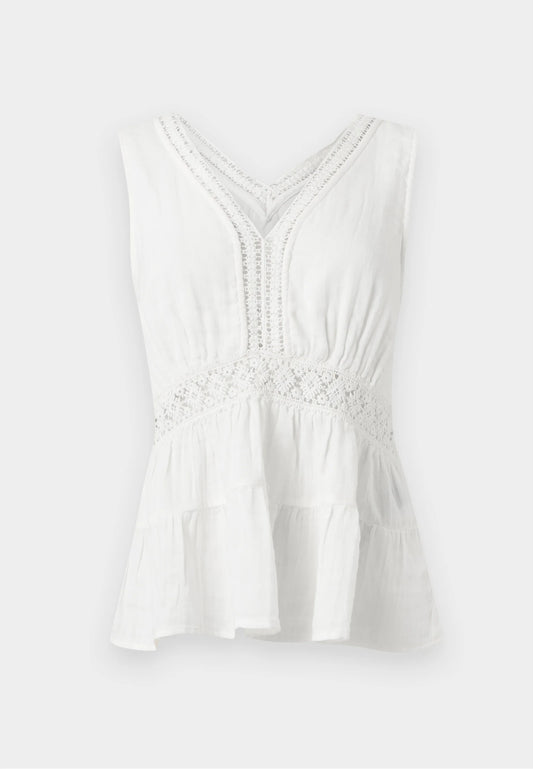 White sleeveless top with lace details on a light gray background