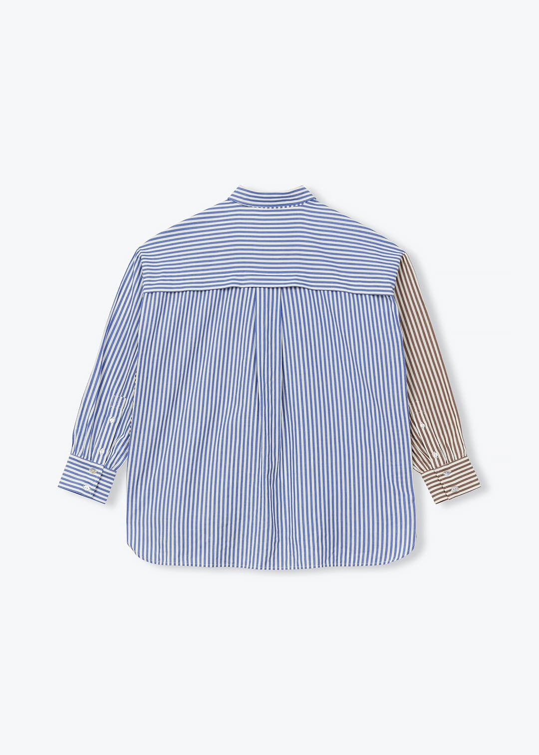 A long-sleeve button-up shirt shown from the back, featuring a blue and white vertical stripe pattern on the main body, a solid blue horizontal stripe across the upper back, and a contrasting brown and white striped sleeve.
