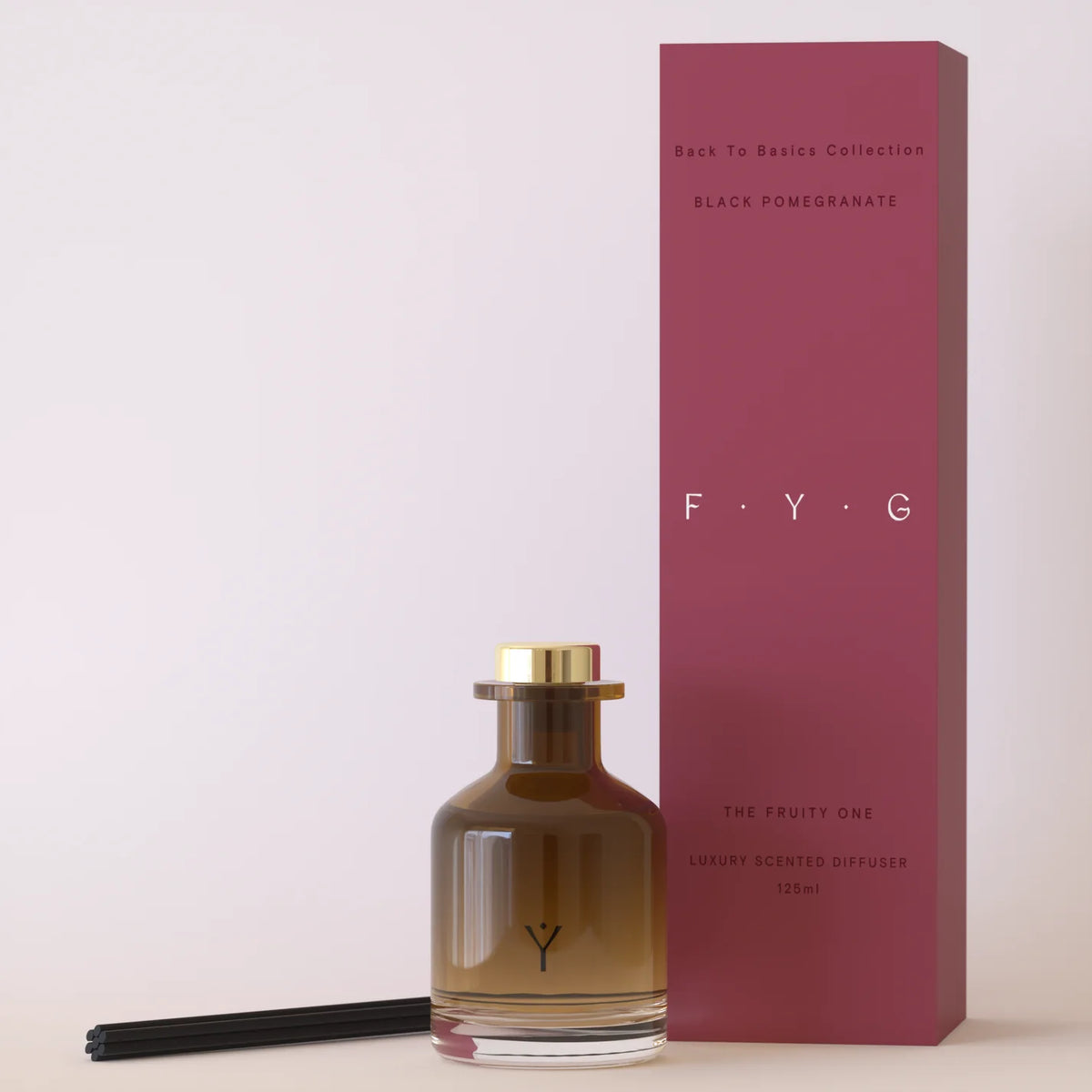 Perfume bottle and packaging with 'F.Y.G.' branding on a white background