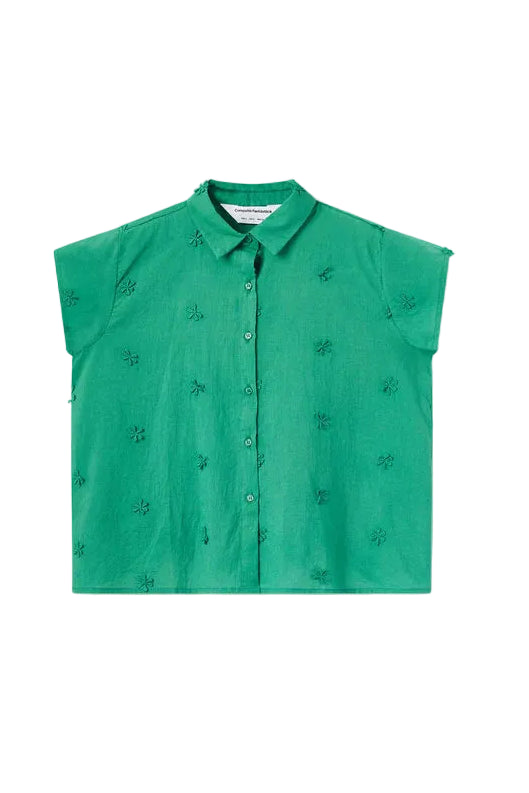 Green sleeveless blouse with small patterns on a white background