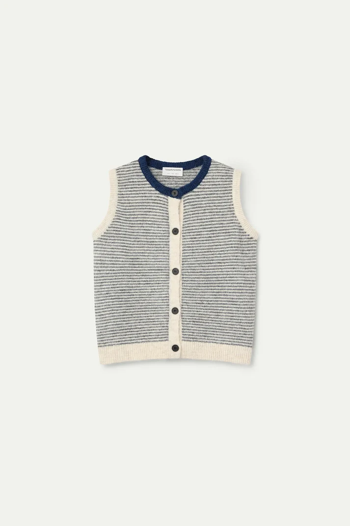 A sleeveless knit vest with horizontal gray and white stripes, featuring a navy blue collar, cream-colored trim, and a three-button front closure, displayed flat against a light off-white background.