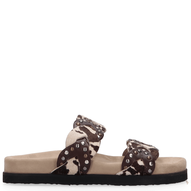 Beige sandal with decorative straps on a white background