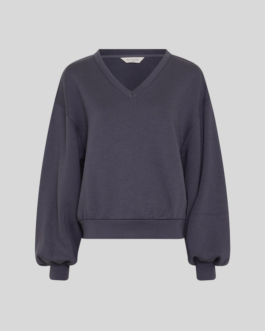 A dark slate gray V-neck sweatshirt with long balloon sleeves and ribbed cuffs, shown against a solid light gray background.