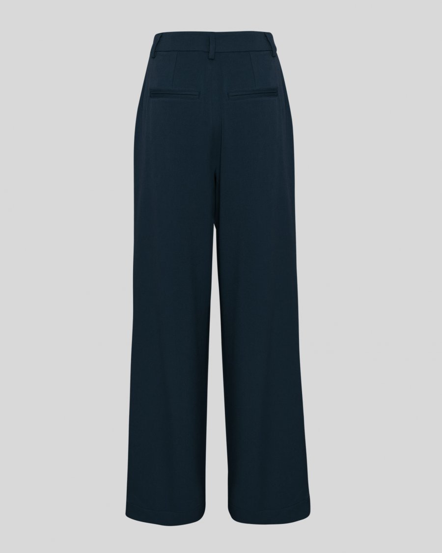 Navy blue wide-leg pants on a light gray background