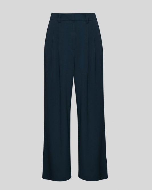 Navy blue wide-leg pants on a light gray background