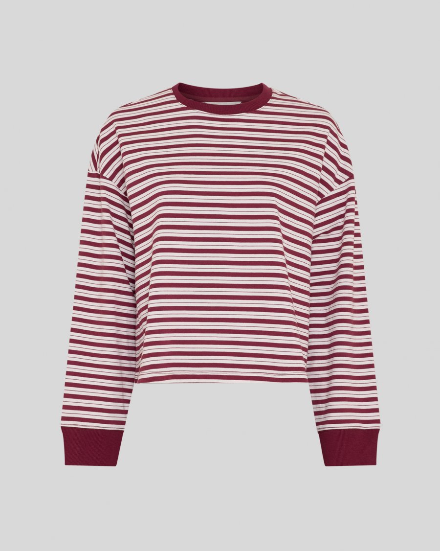 A cropped long-sleeve crewneck top with horizontal burgundy and white stripes, featuring solid burgundy ribbed cuffs and collar, shown against a solid gray background.