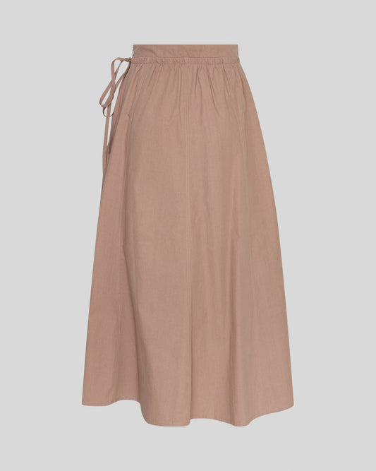 Beige skirt with tie waist on a light gray background
