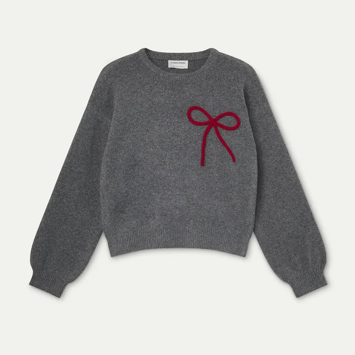 grey jumper with red bow on the front set on a light grey background