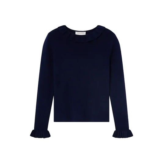 A dark navy blue long-sleeve top with a ruffled collar and matching ruffled cuffs, displayed flat against a light off-white background.