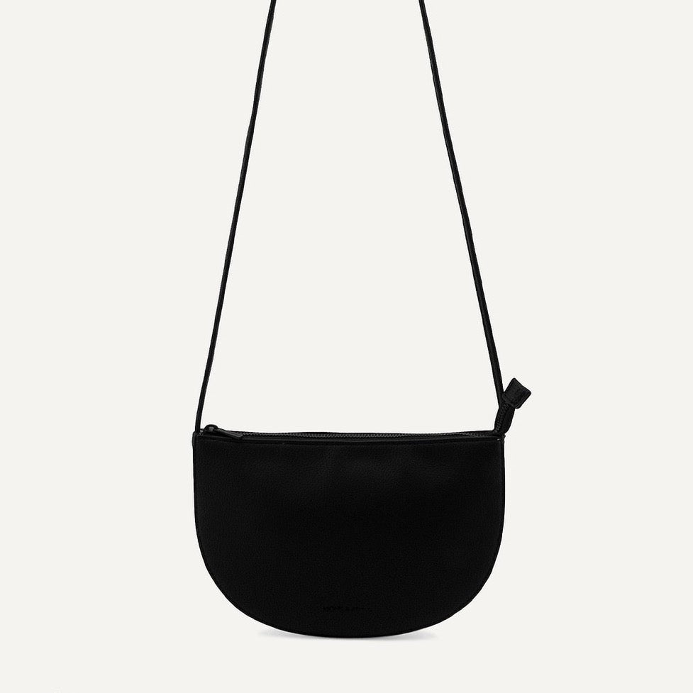 black half moon bag on white background
